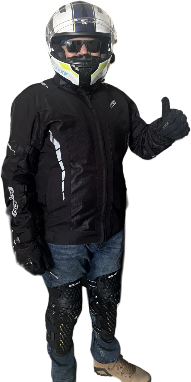 Monk on Meteor in full riding gear, giving a thumbs up